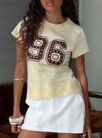 96 Charm Studded Graphic Baby Tee Yellow